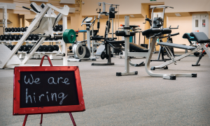 gym hiring sign inside gym